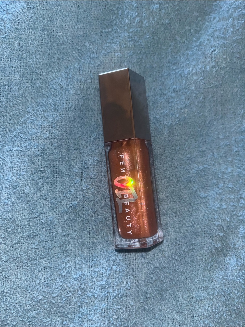 Fenty Beauty Shimmering Copper-Bronze Lip Gloss